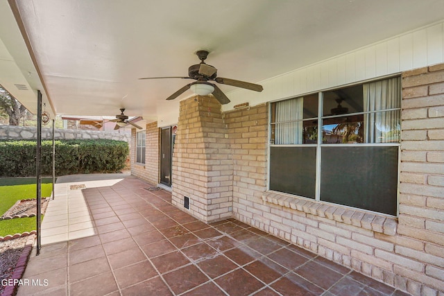 view of patio featuring ceiling fan