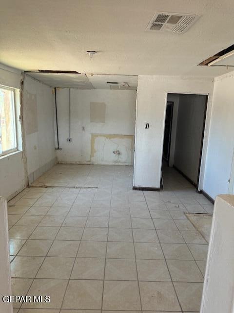 empty room with light tile patterned floors