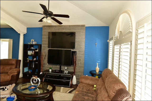 living room with hardwood / wood-style flooring, lofted ceiling, ceiling fan, and ornate columns