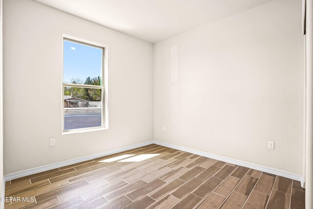 spare room featuring hardwood / wood-style flooring