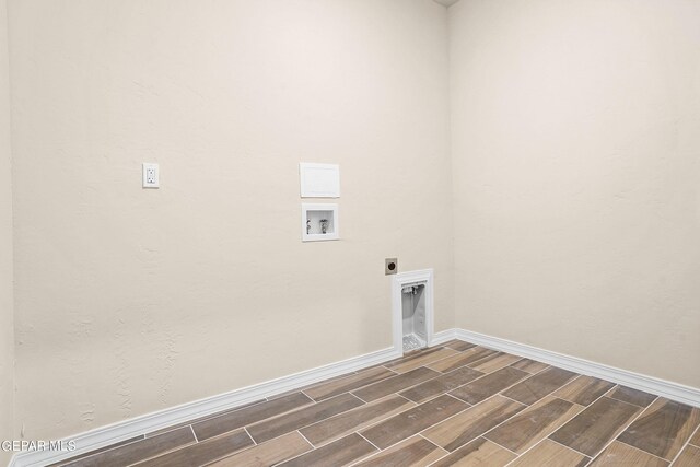 laundry area featuring washer hookup, hookup for an electric dryer, and dark wood-type flooring