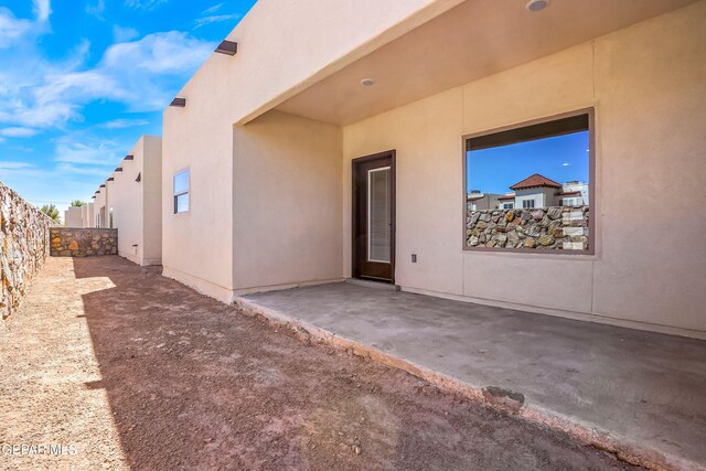 property entrance with a patio area