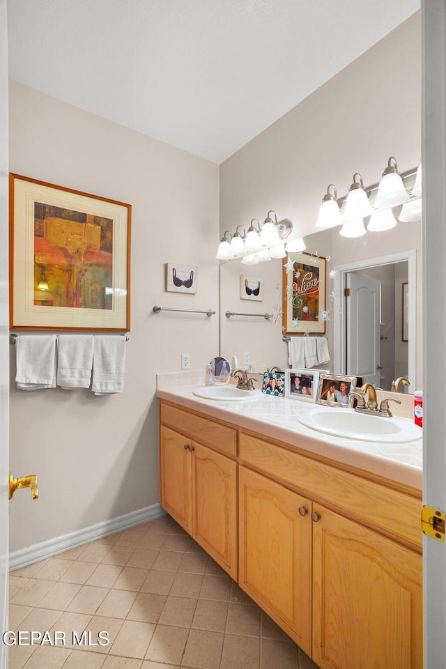 851 Via Alegre Ln, El Paso, TX 79912 - full bathroom featuring double vanity and tile patterned flooring