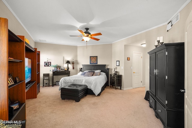 carpeted bedroom featuring ceiling fan and crown molding