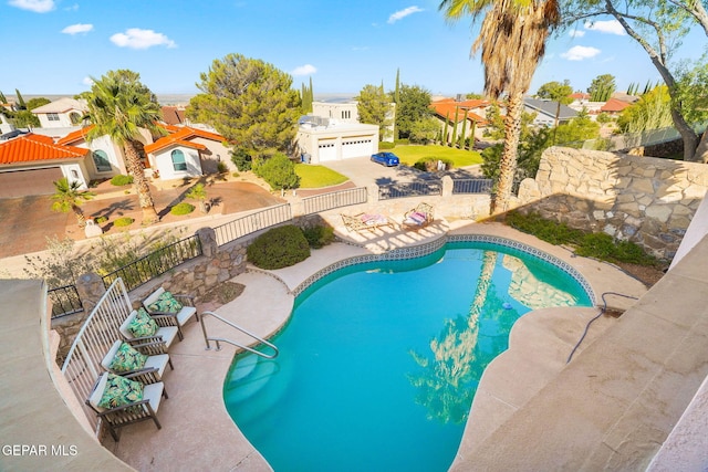 851 Via Alegre Ln, El Paso, TX 79912 - view of pool featuring a residential view, a fenced backyard, and a patio area
