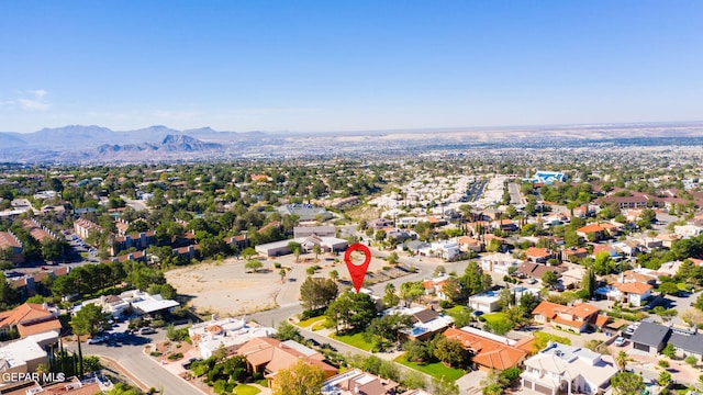 birds eye view of property featuring a mountain view