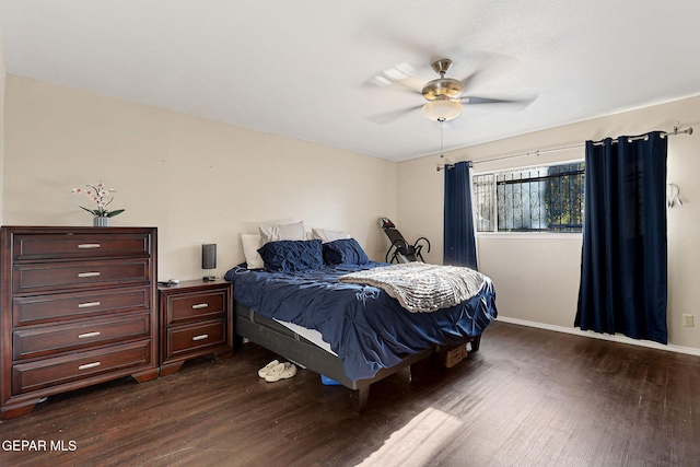 bedroom with dark wood-type flooring and ceiling fan