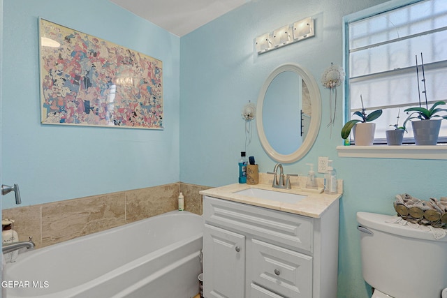 bathroom featuring a bath, toilet, and vanity