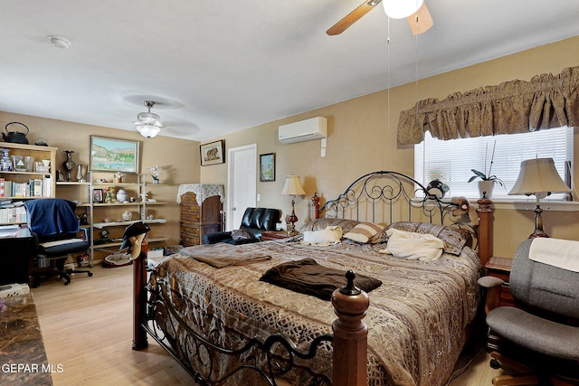 bedroom with a wall unit AC, ceiling fan, and light hardwood / wood-style flooring