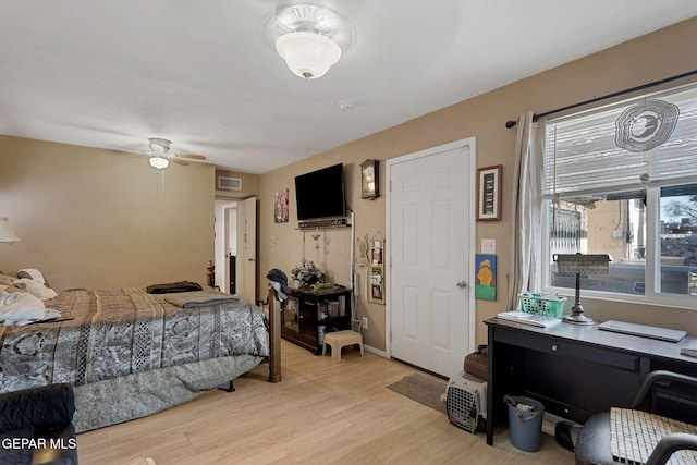 bedroom with light wood-type flooring and ceiling fan