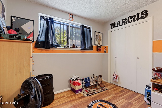 interior space featuring hardwood / wood-style floors and a textured ceiling