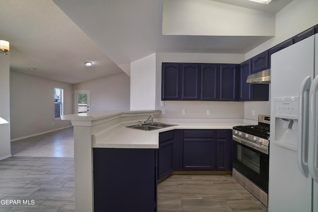 kitchen featuring light hardwood / wood-style floors, kitchen peninsula, stainless steel stove, lofted ceiling, and white fridge with ice dispenser