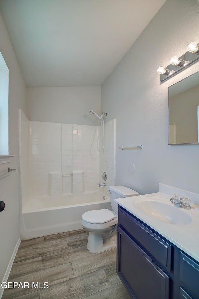 full bathroom featuring shower / bathing tub combination, vanity, toilet, and hardwood / wood-style flooring