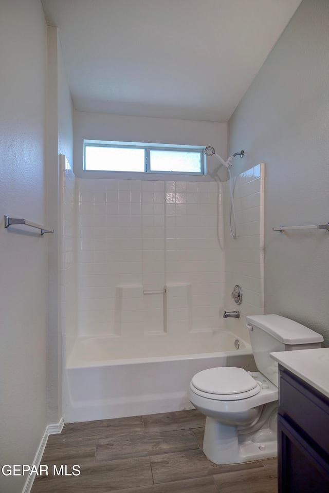 full bathroom with shower / washtub combination, wood-type flooring, vanity, and toilet