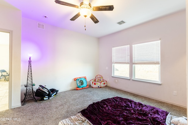 carpeted bedroom with ceiling fan