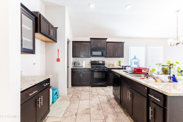 kitchen with sink, a notable chandelier, hanging light fixtures, black appliances, and dark brown cabinetry