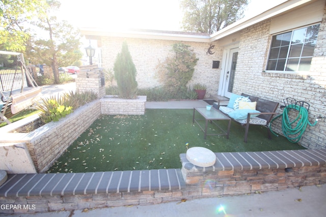 wooden terrace with a lawn