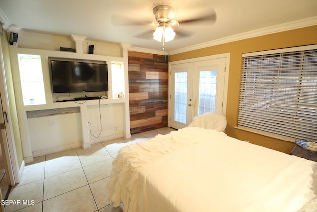 tiled bedroom featuring ornamental molding, ceiling fan, multiple windows, and access to outside