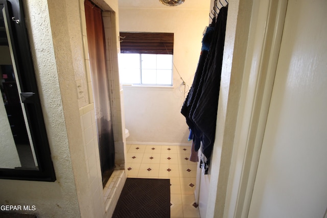 bathroom featuring walk in shower