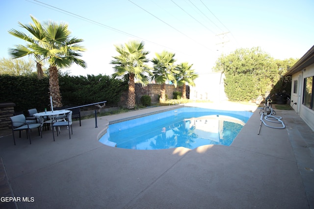 view of swimming pool with a patio area