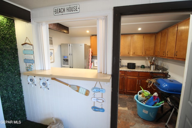 kitchen with refrigerator with ice dispenser