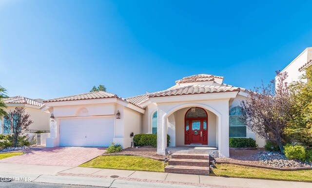 mediterranean / spanish-style house featuring a garage