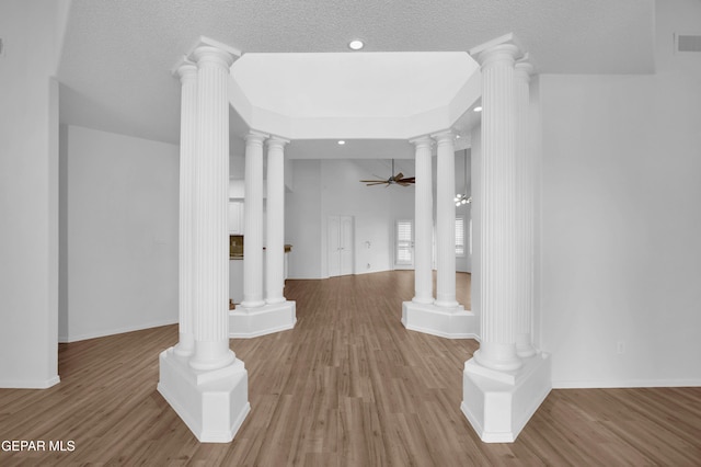 corridor featuring hardwood / wood-style flooring and a textured ceiling