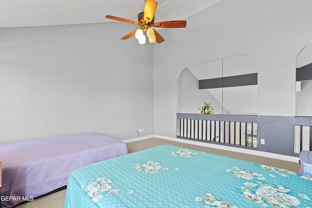 bedroom with high vaulted ceiling, ceiling fan, and carpet flooring