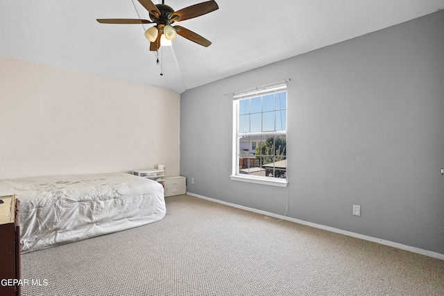 unfurnished bedroom with ceiling fan and carpet flooring