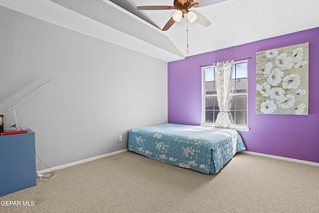 carpeted bedroom featuring lofted ceiling and ceiling fan