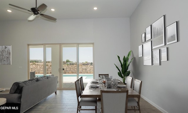 dining space with wood-type flooring, plenty of natural light, and ceiling fan