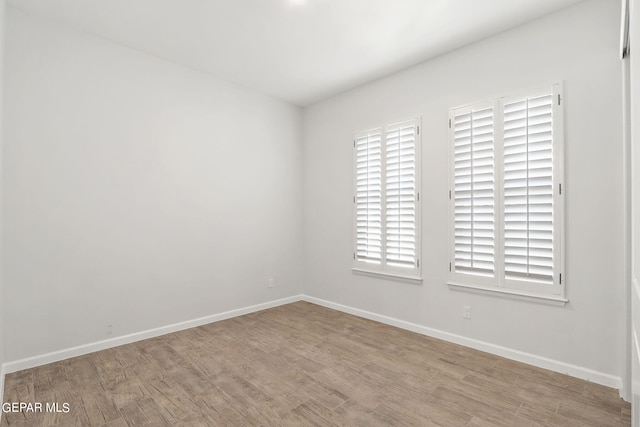 empty room with light wood-type flooring