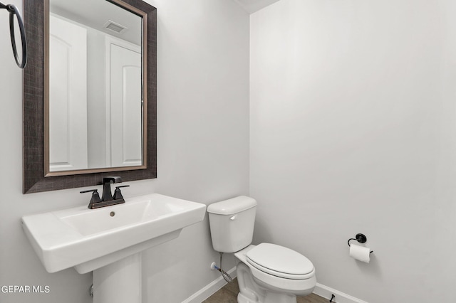 bathroom featuring sink and toilet