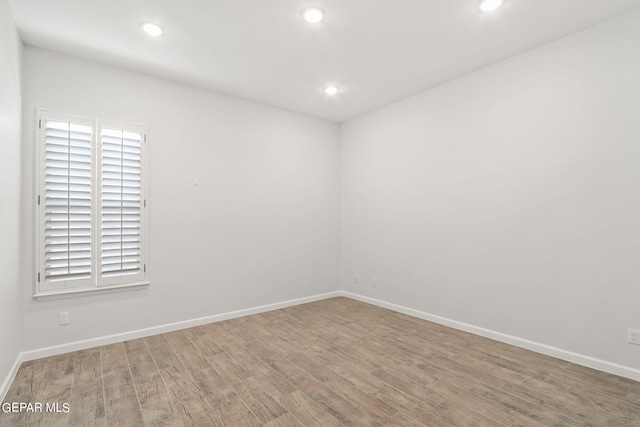 unfurnished room featuring wood-type flooring