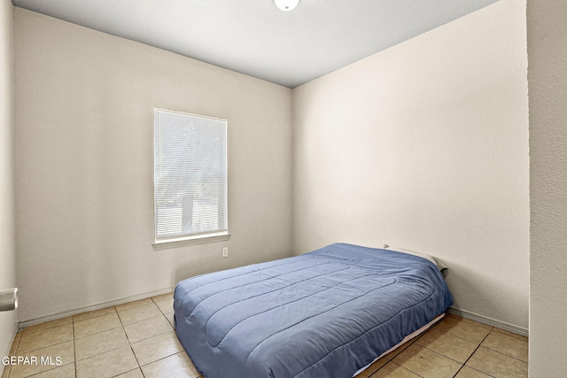 bedroom featuring light tile patterned floors