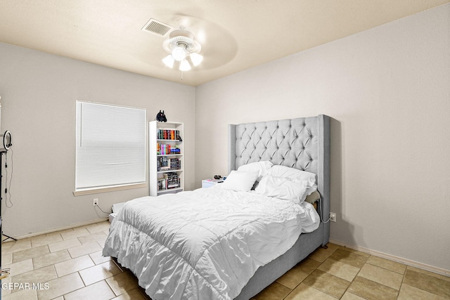 tiled bedroom with ceiling fan