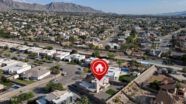 birds eye view of property with a mountain view