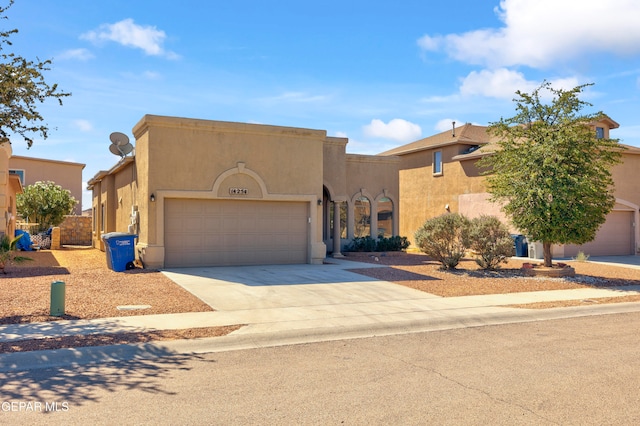 adobe home featuring a garage