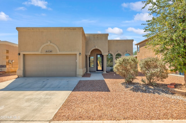 southwest-style home with a garage