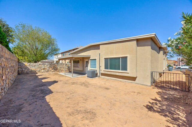 back of house featuring cooling unit and a patio