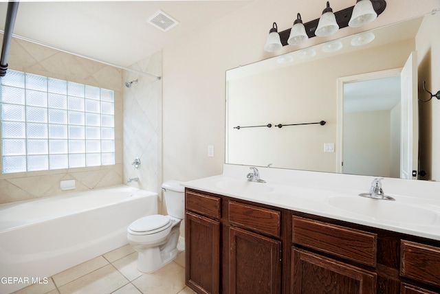 full bathroom featuring tile patterned floors, vanity, toilet, and tiled shower / bath combo