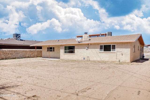 rear view of house with cooling unit and a patio area