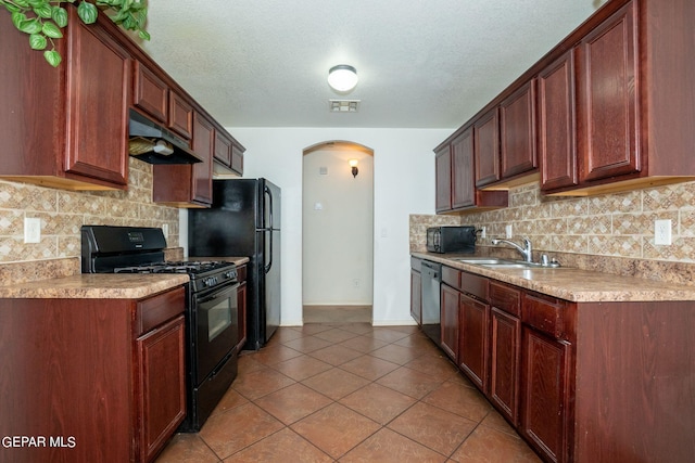 kitchen with a textured ceiling, sink, tasteful backsplash, and black appliances