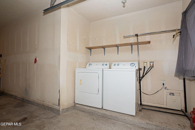 laundry room featuring washing machine and dryer