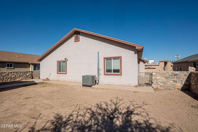 back of property with central air condition unit