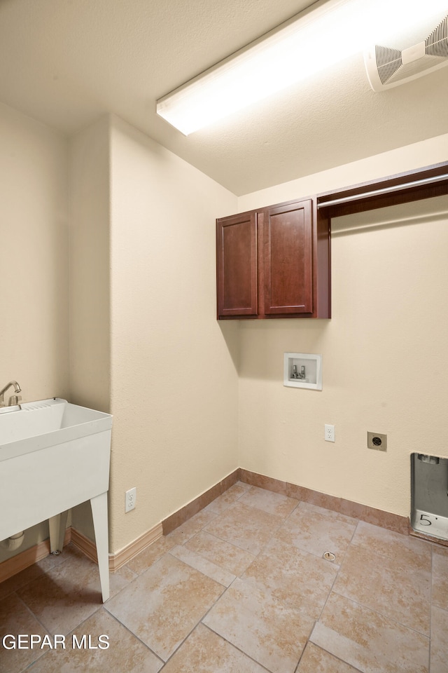 laundry area with washer hookup, cabinets, and electric dryer hookup