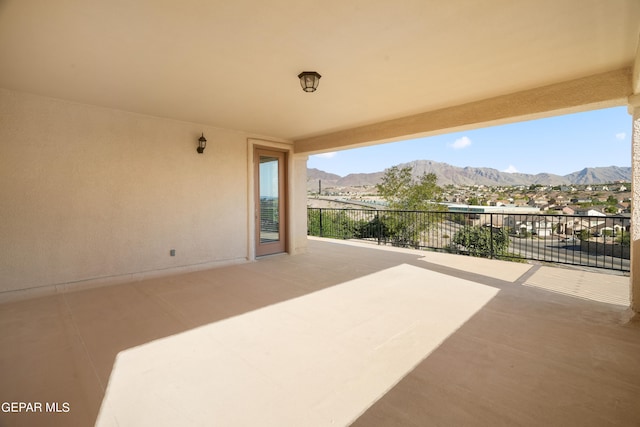 view of patio / terrace with a mountain view