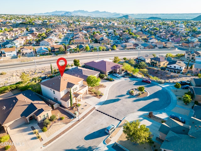 birds eye view of property featuring a mountain view