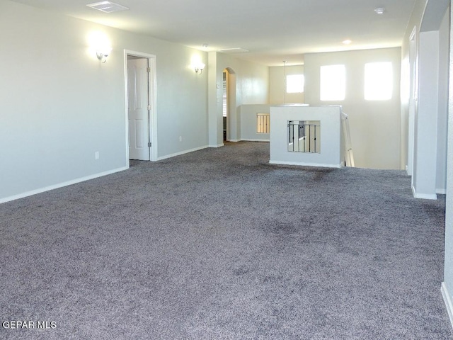 unfurnished living room featuring carpet