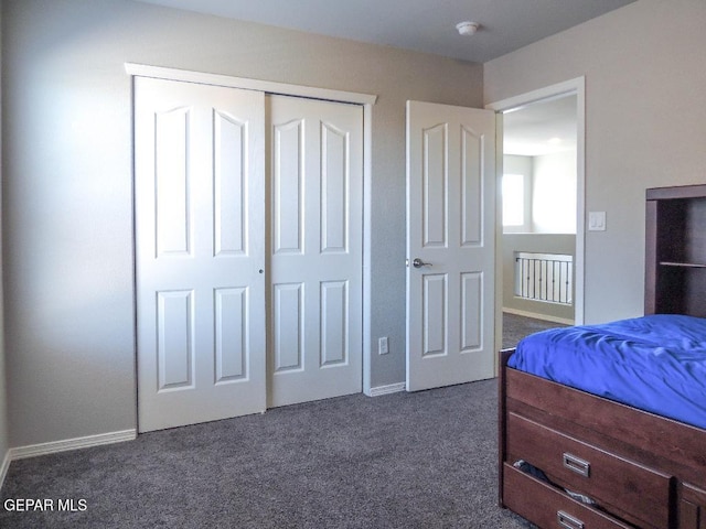 carpeted bedroom featuring a closet